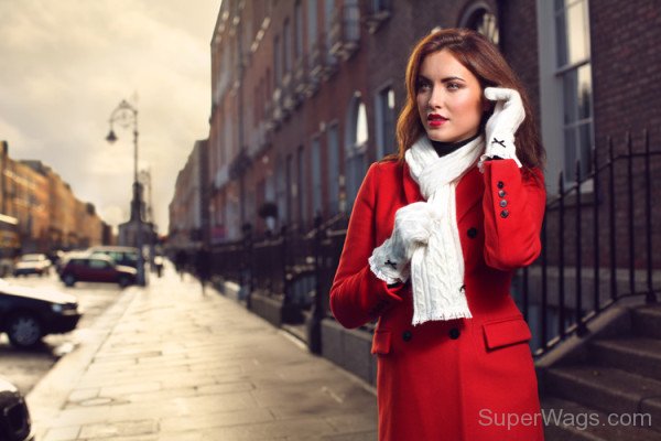 Holly Carpenter Wearing Red Coat