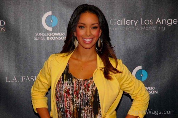 Gloria Govan Wearing Yellow Coat