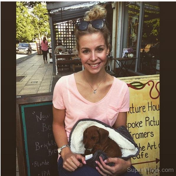 Becky James Holding Dog
