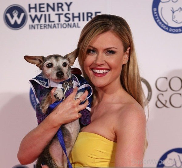 Camilla Kerslake Holding Dog